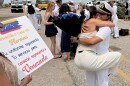 Marien Rincon Media of Chesapeake embraces her sister after USS Fort Lauderdale returns to Norfolk.