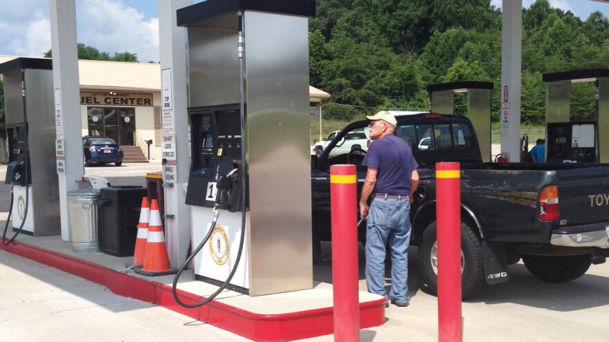 Bob Thomas fills up his pickup truck at the municipal-run gas station in Somerset, Ky. There are no candy bars, 44-ounce soft drinks or lottery tickets sold. The price of gas here is $3.36 a gallon, about 20 cents lower than the statewide average.