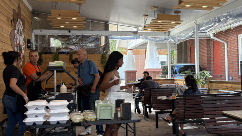 People line up and eat at the Krishna House dining area on Wednesday, March 11, 2026.