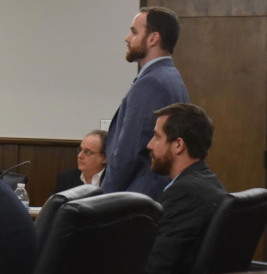 Jim Konish, left, and Adrian Hayes-Santos, right, sit in an Alachua County courtroom before Judge Monica Brasington on Tuesday. (Sara Marino/WUFT News)