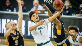 Action shot of Diego Bernard vs West Liberty basketball