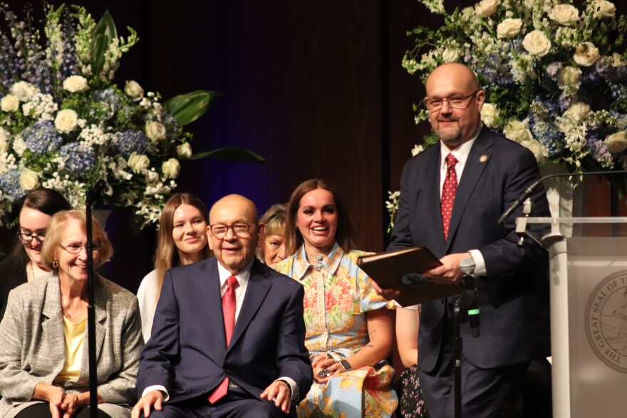 Bill Anoatubby transfers the Chickasaw gubernatorial pin to Chris Anoatubby in Ada on June 26, 2026.