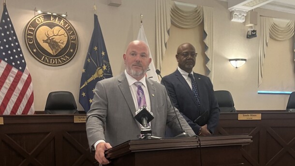 New Elkhart Police Chief Ray Juengst takes questions from reporters Monday at City Hall with Mayor Rod Roberson standing behind him.