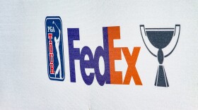 FILE - Banner reads "FedEx," with the PGA Tour logo during the final final round of the RSM Classic golf tournament, on Nov. 24, 2024, in St. Simons Island, Ga.