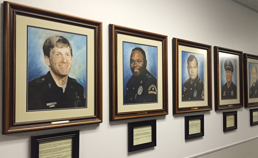 The hallway of the Dallas police academy is lined with portraits of every Dallas officer who has been killed in the line of duty.