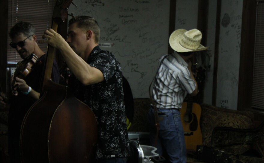 Bo Isaac band jams in the green room before a performance.