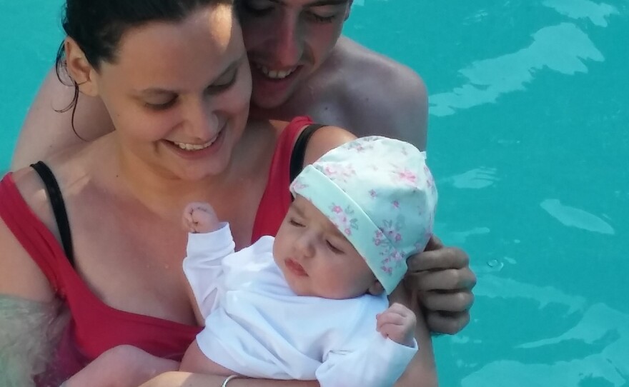 Brenna and Dylan O'Riordan hold their daughter, Delilah. The couple was recently married in the jail chapel.