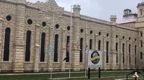 Flags fly at half-staff on March 24, 2021 outside the Anamosa State Penitentiary, one day after state officials say two inmates killed a nurse and a correctional officer while attempting to escape the prison.