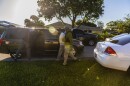 Immigration officers take a man into custody 