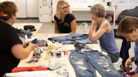 Textile artist Amy Meissner (center) at the Anchorage Museum's SEED Lab, where she leads mending workshops to repair clothes and other gear. (Joshua Corbett/SEED Lab photo)