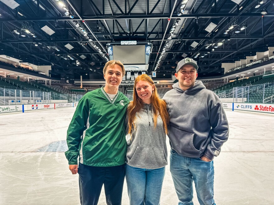 Sarah Corey poses for a picture with the other student zamboni drivers at Munn Ice Arena on April 8, 2025. Toby Smith (left) said Corey felt like a natural pick for the role. “She was the next possible person I could think of to get the job,” he said. “She just gets it.”