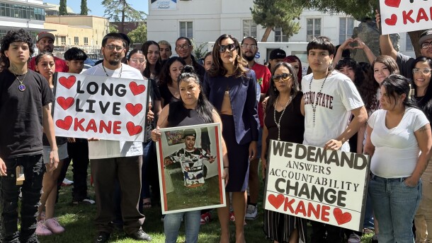 Family, friends and a legal representative holding signs regarding Rubio’s case outside the Fresno County Hall of Records while filing a government claim on the morning of Wednesday, July 8, 2026.