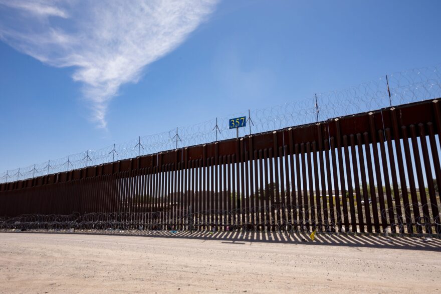The border wall stretches along a dirt road near Sunland Park, N.M.