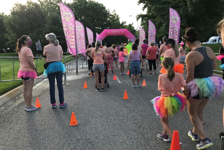 Orange cones signaled appropriate spacing for Diva Dash participants at the starting line.