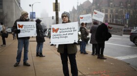 Barbara Chicherio, of the Gateway Green Alliance, protests Monsanto outside the Civil Courts Building on Jan. 24, 2020.