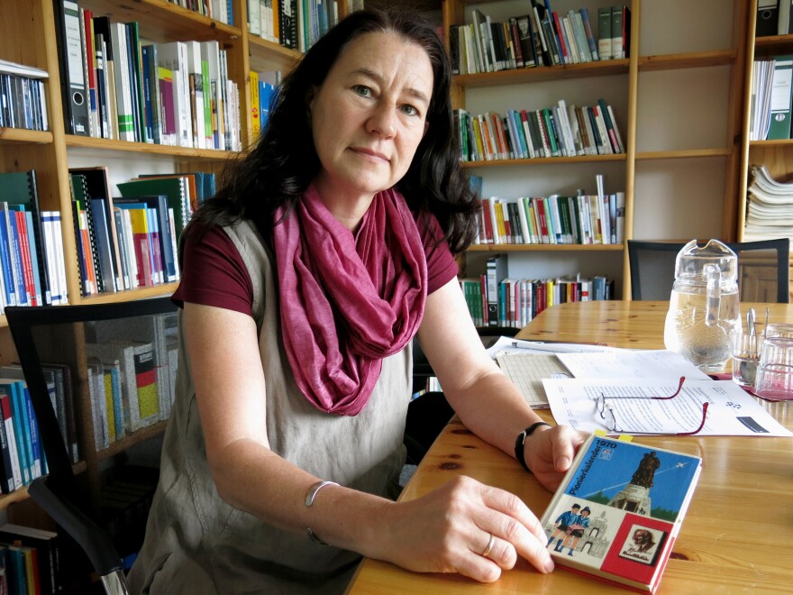 Anne Drescher, head of the archive at the local Stasi, or East German state police, displays an old diary from East German times, featuring Lenin on the cover. The archive is often used by victims and their survivors of the East German communist regime. Drescher is in favor of removing the Lenin statue.