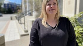 A woman poses for a portrait outside