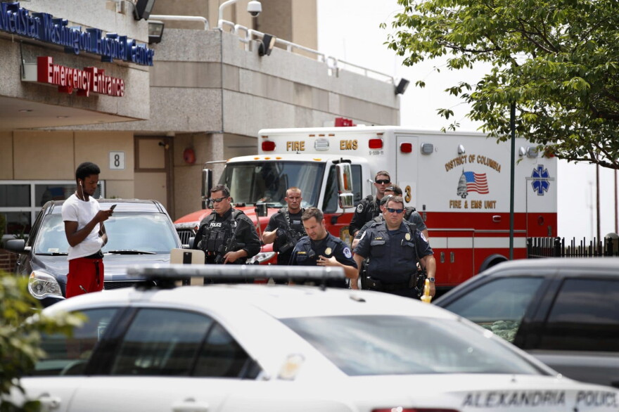Capitol Hill Police leave the emergency entrance at MedStar Washington Hospital Center in Washington, Wednesday, June 14, 2017, where House Majority Leader Steve Scalise of La. was taken after being shot in Alexandria, Va., during a Congressional baseball practice. (Jacquelyn Martin/AP)