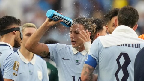 Uruguay’s Agustin Canobbio cools off during a hydration break during a match with Saudi Arabia on June 15.