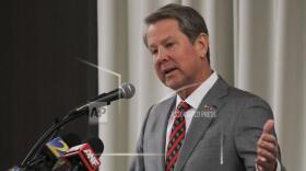 FILE - Georgia Gov. Brian Kemp speaks, Feb. 26, 2024, in Athens, Ga. Georgia lawmakers have made it harder for workers at companies getting state economic incentives to unionize, in what could be a violation of federal law. The state House voted 96 to 78 Wednesday, March 20, for Senate Bill 362, which would bar companies that accept state incentives from recognizing unions without a formal secret-ballot election. The measure, which has been backed by Gov. Kemp, now goes to the Republican governor for his signature. (Nell Carroll /Atlanta Journal-Constitution via AP, file)