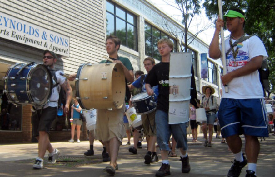 About 30 people with Occupy Grand Rapids march through downtown towards their new camp.