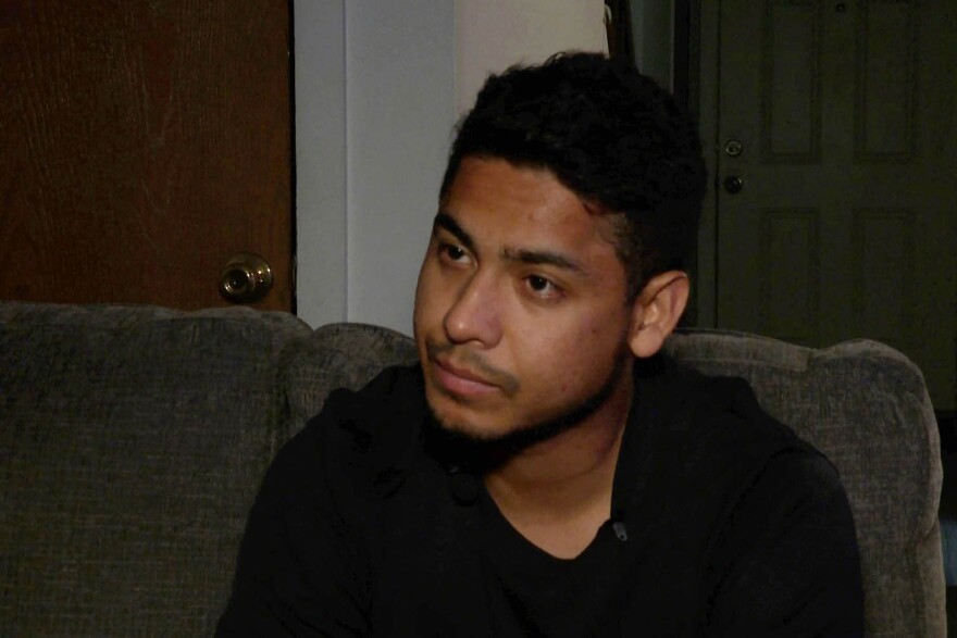 man looking off-camera during interview