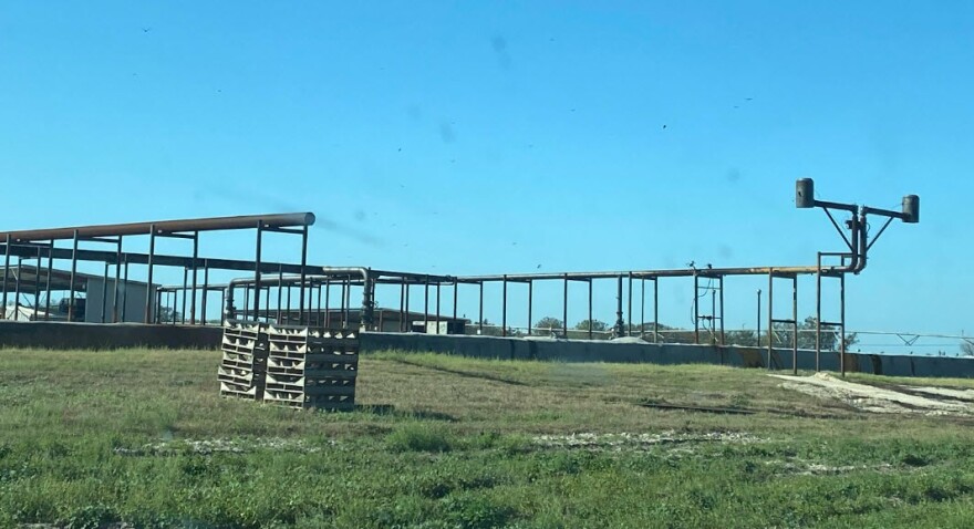  The above-ground portion of the anaerobic digester in the middle of a field