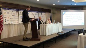 Chad Hutchison, a lobbyist for the University of Alaska, moderates the candidate forum for the Greater Fairbanks Chamber of Commerce. At the table are former are current Fairbanks City Council members, David Pruhs and Valerie Therrien. The forum was at Wedgewood Manor on Tuesday, August 30, 2022.