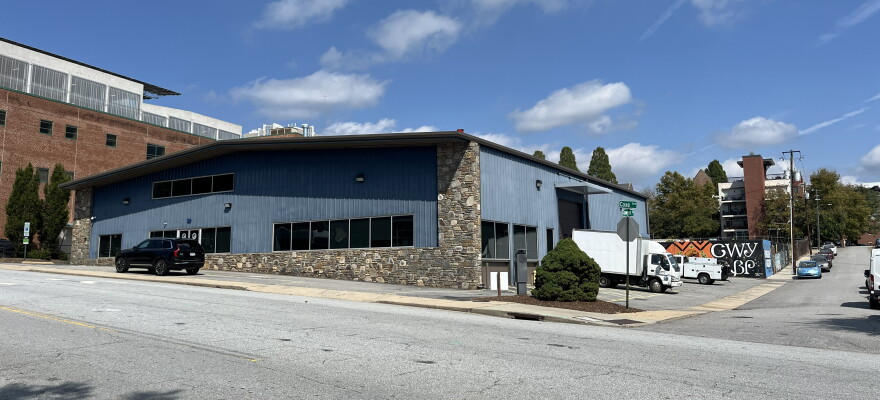 Buncombe County government plans 203 affordable apartments on property at 50 and 52 Coxe Ave. in downtown Asheville, but a county staffer says it is $15 million short of having the money needed for the project.
