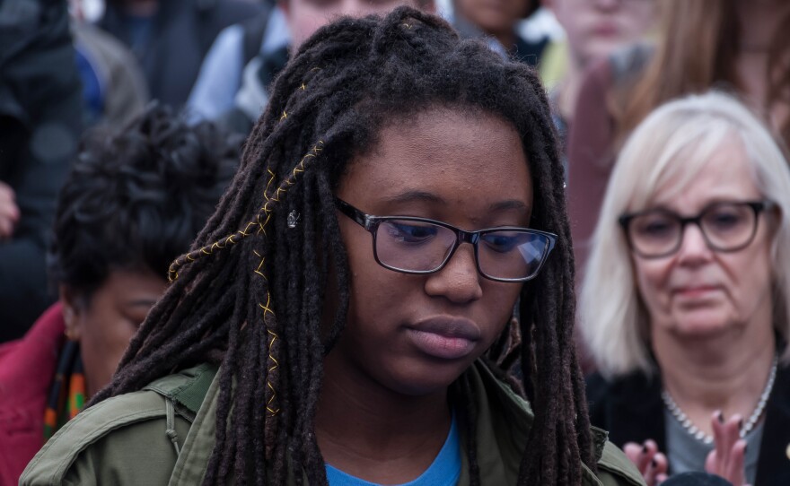 Hayley Bridges, a senior at Clayton High School, reflects after saying school is one places she should not have to worry about a shooting. She and dozens of other students walked out of the school Friday, Feb. 23, 2018, to call for gun control measures.