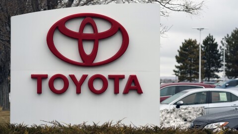 The Toyota logo adorns a sign outside a dealership