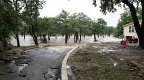July 16, 2026: Debris covers a yard in Kerrville from the Guadalupe River rising over into residential properties. Kerrville, Texas.