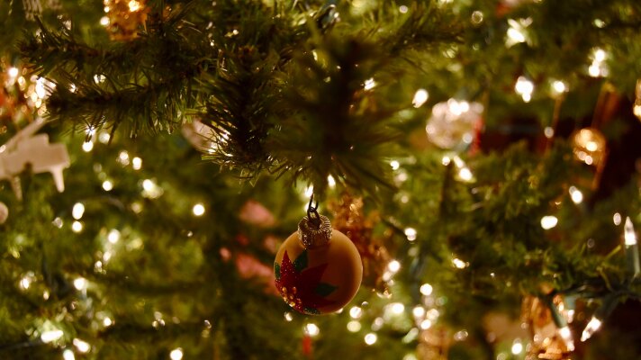 A close up of a decorated and lit Christmas tree.
