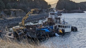 Eyewitnesses saw several pieces of heavy equipment used to pull the boat out of the water. (Terry Haines/KMXT)