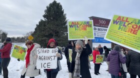 Colonie Indivisible and Afghan community members at Congressman Tonko's press conference holding signs that read "All Are Welcome Here"