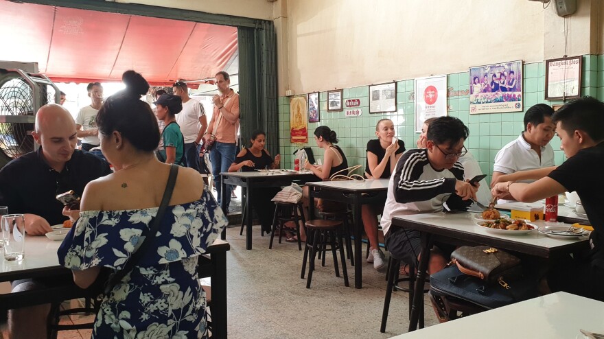 Kashmira Velji and Ana Wong (front table, right) got to the restaurant at 7:30 a.m., even though it didn't open until 2 p.m., and were able to score the top spot on the walk-in list. Both agreed the food was worth the seven-hour wait.