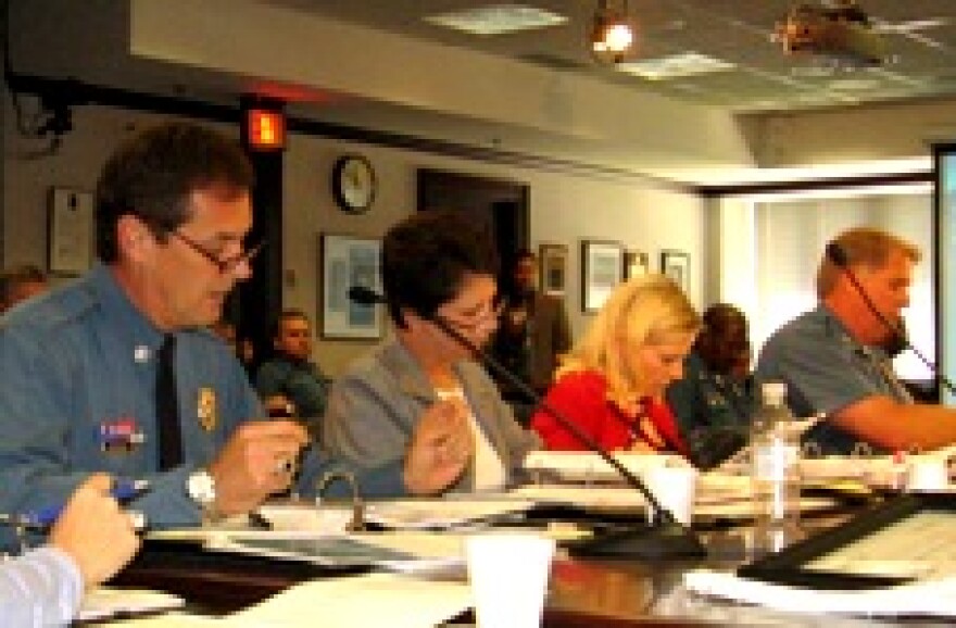 Deputy Chief Cy Ritter (l) cites response time data to Board of Police Commissioners.