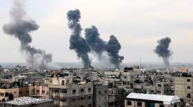 A picture taken on Dec. 20, 2023, from Rafah shows smoke billowing after Israeli strikes over the Nuseirat refugee camp in the central Gaza Strip, amid ongoing battles between Israel and the militant group Hamas. (Mahmud Hams/AFP via Getty Images)