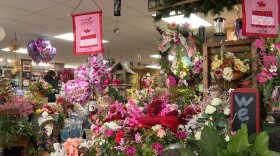 Employees at Mary M's Walnut House Flowers stay late into the night working into the night to finish preparing bouquets for the holiday.
