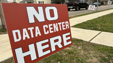 Signs opposing a data center north of Ashville, Ohio line the streets of that village.