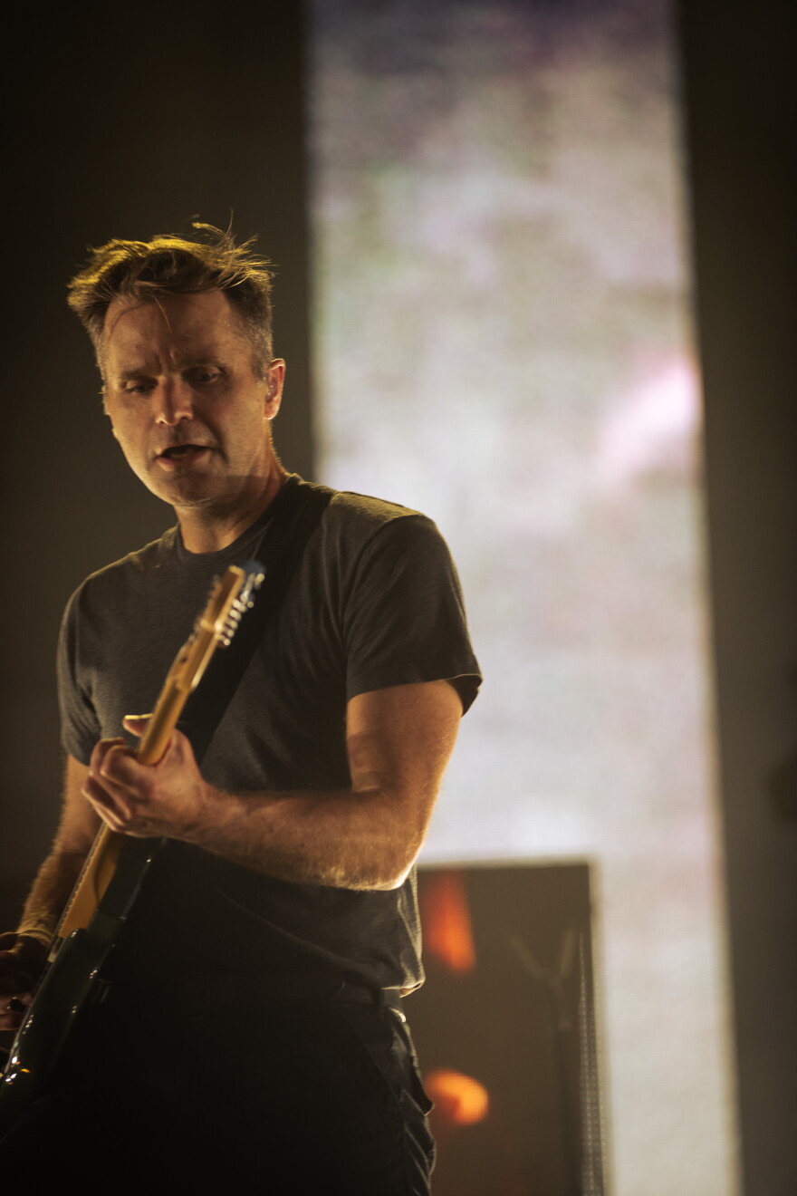 a man playing guitar 
