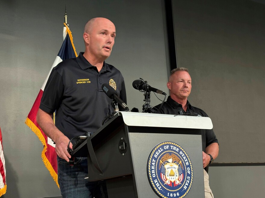 Utah Gov. Spencer Cox, left, speaks with Utah Valley University Chief of Police Jeff Long, right, at the Keller Building on the Utah Valley University campus after Charlie Kirk was shot and died during Turning Point's visit to the university, Sept. 10, 2025, in Orem, Utah.