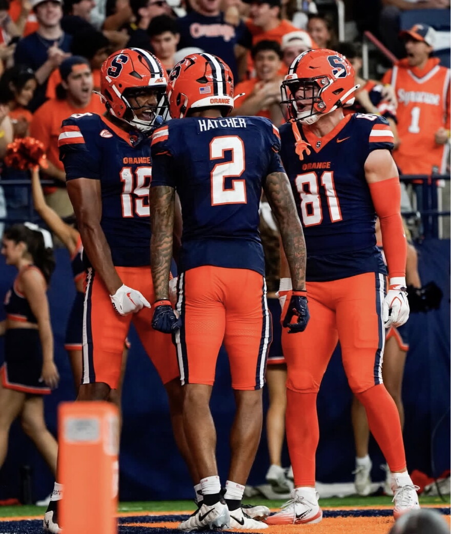 Syracuse’s pass catchers (Blue) celebrate a touchdown during its 23-21 loss to California Saturday.