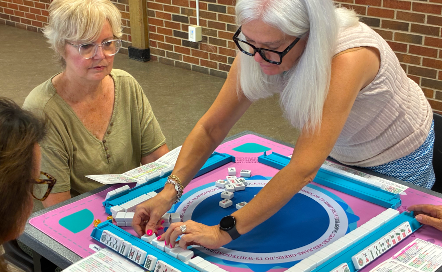 Instructor Tracy Callard sets up a Mahjong game at the Edgemoor Recreation Center.