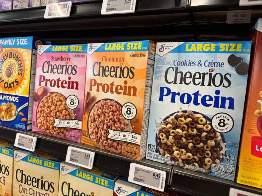 A Cheerios cereal box lineup touts its enhanced protein properties at a local grocery store in Moorhead, MN, on Friday, Feb. 20, 2026.