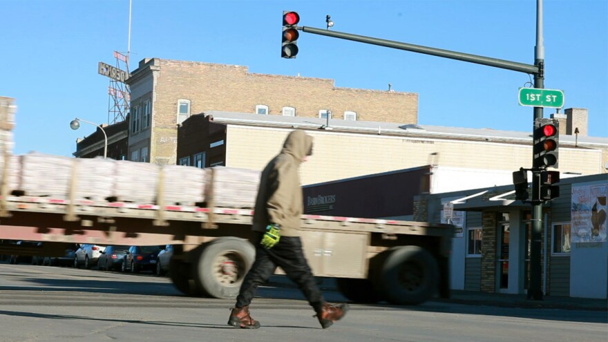 The small streets of Williston, N.D., are bustling with trucks early in the morning.