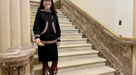 woman in fur boots on marble stairs