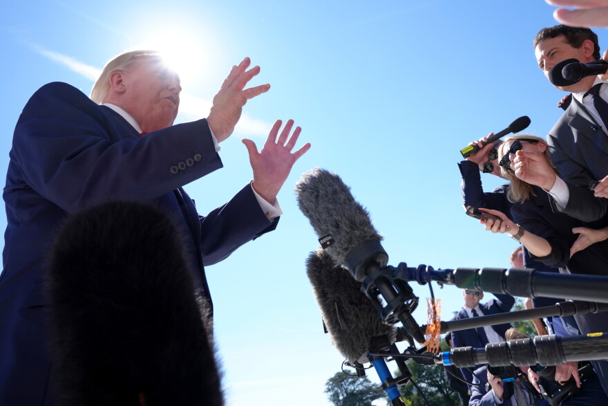 President Donald Trump speaks with reporters before boarding Marine One on the South Lawn of the White House, Thursday Oct. 1, 2026, in Washington. (AP Photo/Jacquelyn Martin)