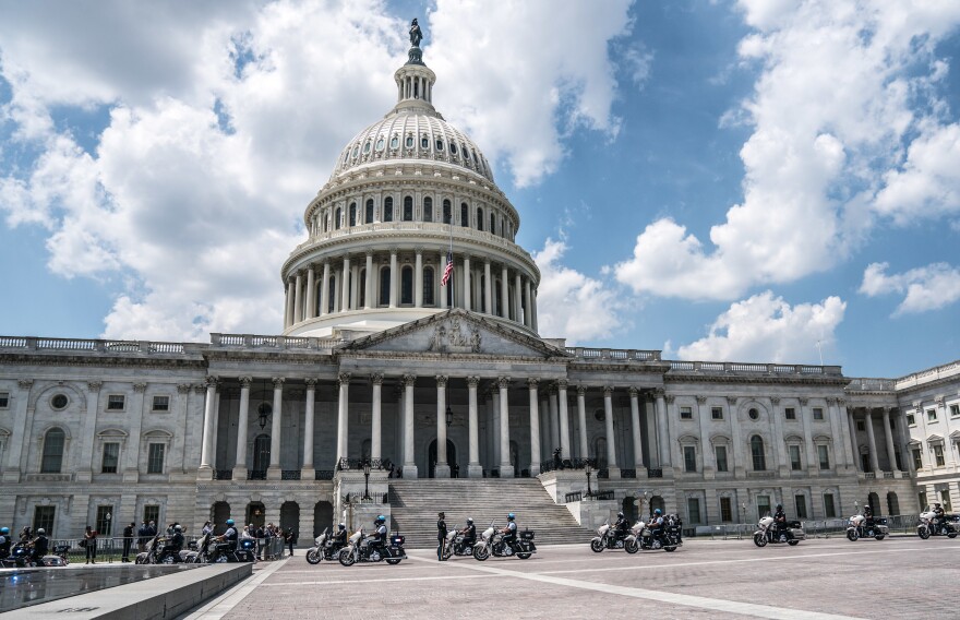 The police motorcade for John Lewis arrives at the U.S. Capitol.