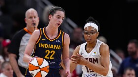 Indiana Fever guard Caitlin Clark (22) drives on Atlanta Dream guard Allisha Gray (15) during the first half of a preseason WNBA basketball game in Indianapolis, Thursday, May 9, 2024. (AP Photo/Darron Cummings)